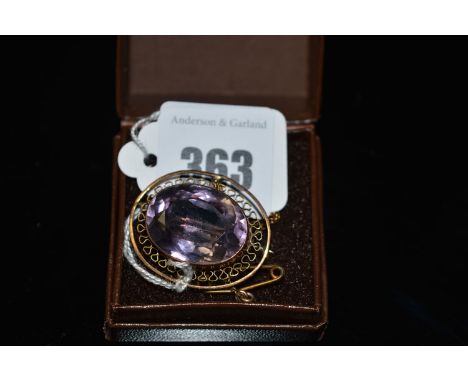 An amethyst set yellow metal brooch, the oval facet cut amethyst collet set with engraved mount 'Miss Cooper, Morpeth, 29/1/1