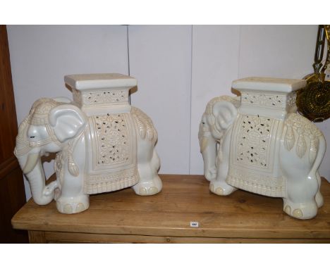 A pair of ceramic garden seats in the form of elephants.