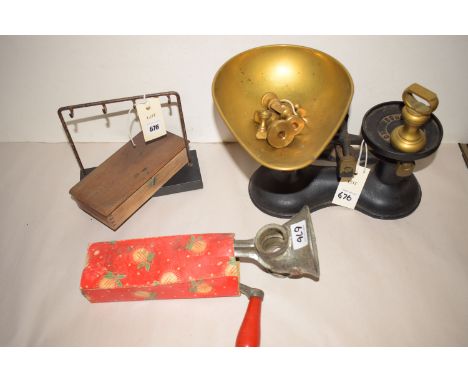 Early 20th Century rules by Rabone; a set of postal scales; brass and cast iron scales by Boots, Nottingham; a mincer.