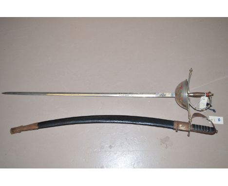 An Indian reproduction sabre, the blade inscribed 'Made in India', in black imitation leather scabbard; together with a decor