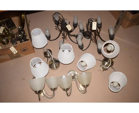 A pair of three-branch ceiling lights, with matching white pleated shades; together with a pair of modern wall lights with gl