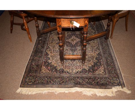 A Qum style rug, ivory field with central medallion, 200 x 124cms approximately.