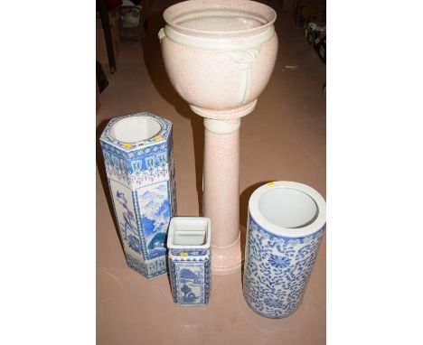 Three modern Oriental ceramic stick stands; together with a jardiniere and stand.