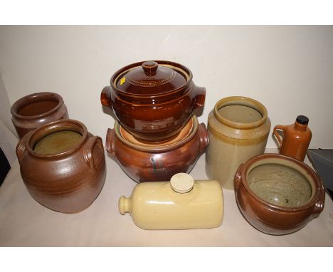 A collection of ceramic and stoneware pots and jars.