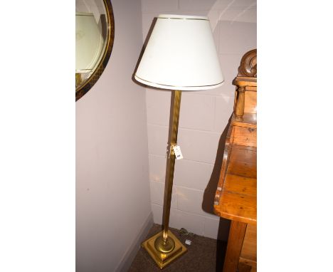 A modern standard lamp and shade.
