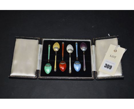 A set of six silver gilt and coloured enamel teaspoons, by Turner & Simpson, Birmingham 1978, in fitted case.