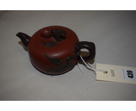 Chinese Yixiang three colour stoneware teapot and cover, of flattened globular form with gnarled branch handle, spout and fin