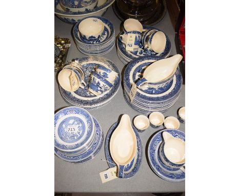 A large collection of 20th Century blue and white 'Willow' pattern dinner service, comprising: dinner plates, bowls, side pla