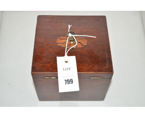 A George III mahogany tea caddy, with paterae to cover, fitted brass handles, decorated throughout with stringing, 6 x 6 x 5i