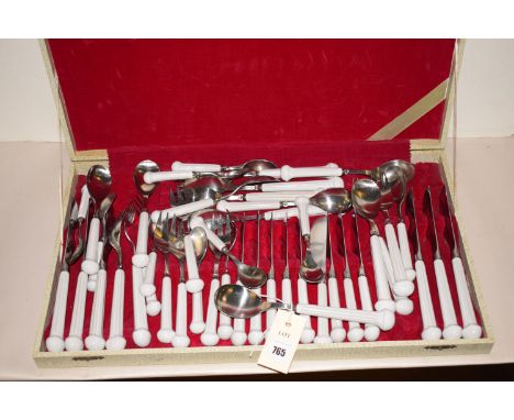 A canteen of Denby white ceramic handled cutlery, in fitted crocodile skin effect case.