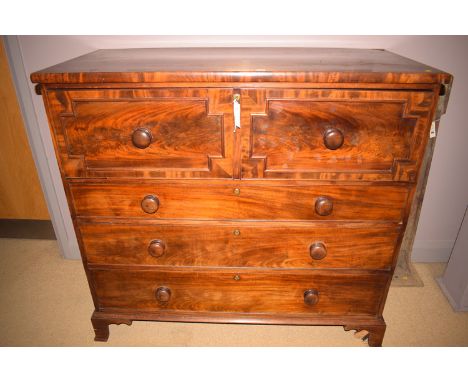 A Victorian mahogany secretaire chest of drawer fitted turned handles, pull-out secretaire section above three long graduatin