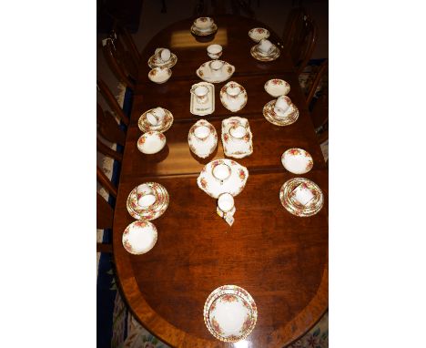 A Royal Albert ''Old Country Roses'' pattern tea and breakfast set, comprising: mugs, cups and saucers, bowls, plates, cake p