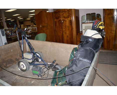 A golfer's power caddy with charger and battery; together with four left-handed golf clubs and nine irons by Cleveland - King