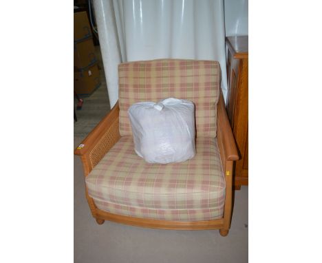 A modern Ercol bergere armchair, with loose seat and back cushions.