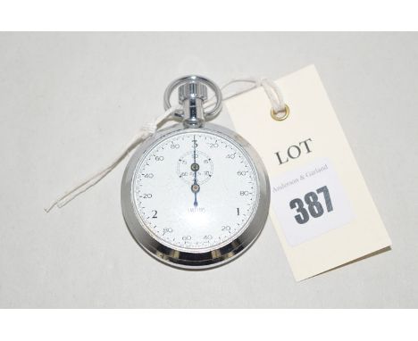 A Smiths military stopwatch with arabic dial in steel case the back stamped "0552/916-0180 198/69 Broad Arrow Mark".