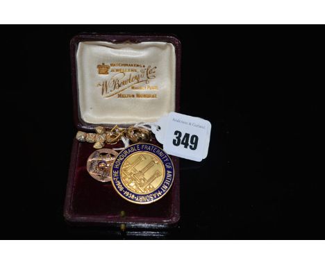 A pair of giltmetal folding ball pattern Masonic drop earrings; a yellow metal Masonic fob pendant; and a giltmetal and ename