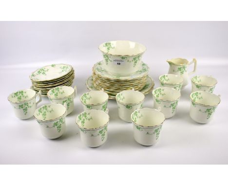 A Wellington part tea service. Including cups and saucers, plates, a cream jug and sugar bowl