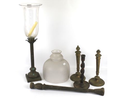 An assortment of lamp bases, shades and candlesticks. Including a cast metal example with glass shade, H66cm, an oak barley t