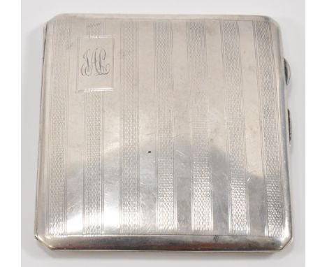 A hallmarked silver cigarette case of square form having engine turned decoration to the case with engraved initials to the c