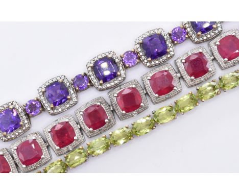 A group of three silver stone set bracelets to include a line bracelet set with square and round cut amethysts, line bracelet