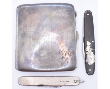 A silver hallmarked cigarette case of plain form being engraved with a message to the corner dated 1923 (hallmarked Birmingha