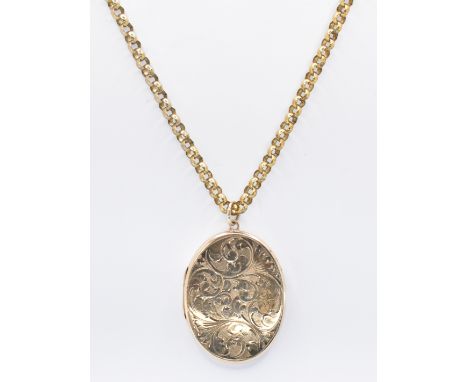 A hallmarked 9ct gold locket of oval form having engraved foliate sprays to the front. Hallmarked rubbed, date letter r visib