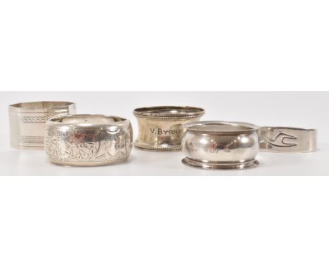 A harlequin set of five silver napkin rings to include a John Rose engine turned octagonal example (hallmarked Birmingham 196