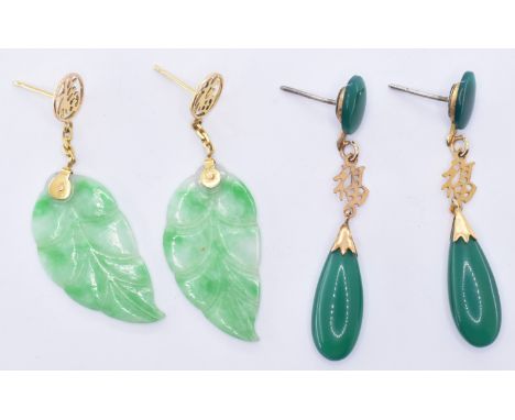 A pair of 14ct gold drop earring having jade panel drops carved as leaves (marked 585 to the earrings backs, weight 4.1g) tog