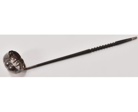 A Francis Howard Ltd silver hallmarked ladle having a quatrefoil shaped bowl with an ebonised wooden stem with carved twisted