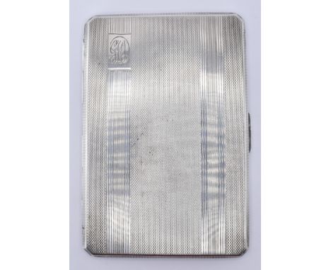 A vintage silver hallmarked cigarette case having engine turned decoration to the exterior, with initials engraved to the cor