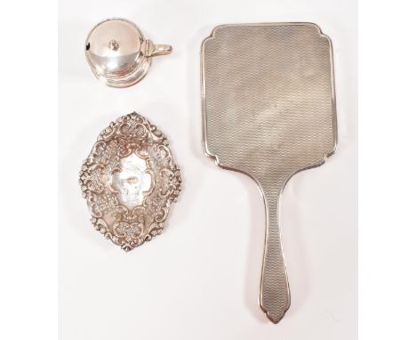 A late Victorian silver pin tray with pierced decoration hallmarked for Sheffield, 1898 with a silver mustard pot with blue g