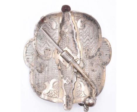 A late 19th Century Russian silver belt buckle. The buckle having engine turned and engraved decoration with a pistol suspend