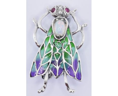 A &nbsp;925 silver and plique a jour brooch. The brooch in the form of an insect with a central opal cabochon to the centre a