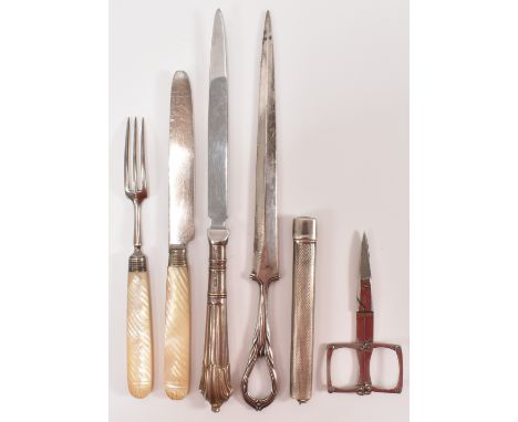 A George IV silver knife and fork set having carved mother of pearl handles (marked with head and sterling lion) together wit