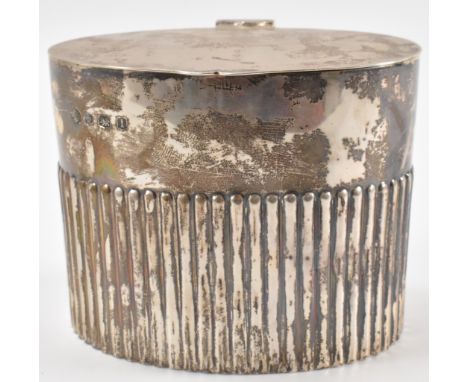 A 1920's Art Deco era William Hutton &amp; Sons silver hallmarked lidded pot / tea caddy of oval form with reeded sides. Hall