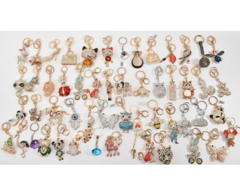 A large collection of&nbsp; TJC NOS new old stock crystal set white metal and yellow metal keyrings to include examples in th