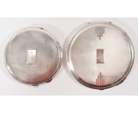 A pair of silver hallmarked ladies compact mirrors, one having&nbsp; Art Deco engine turned decoration to the case and the ot