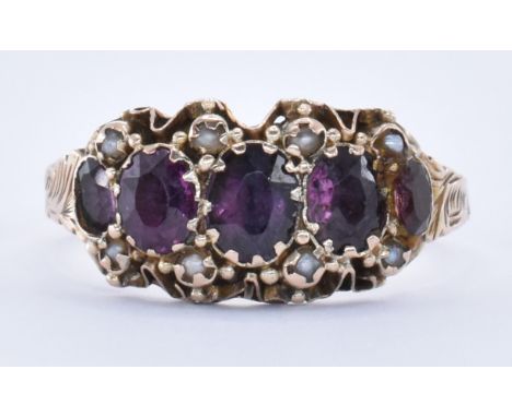 A 19th Century Victorian 9ct gold and amethyst five stone ring set with graduating oval cut amethysts with seed pearl accent 