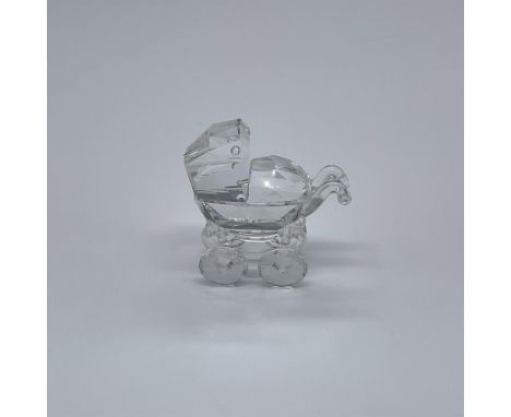 Part of the When We Were Young series. A pram made from clear crystal. Swarovski swan mark. This item has its original box: 4