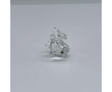 Clear crystal body, fins and tail with blue/green eyes. Tail is flipped upwards. Swarovski etched backstamp. This item has it