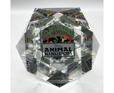 Limited edition cut crystal orb designed with Animal Kingdoms colorful signage. Colored in green, black and orange. Felt cove