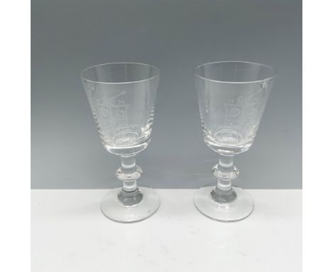 Lovely duo of clear crystal goblets with an etching of a crest with the Heisey H in the middle. Issued: 1974Dimensions: 2.75"