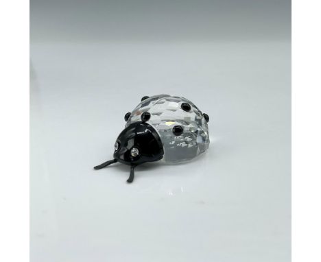 This charming ladybug figurine showcases a clear crystal body, while its head, antennae, and spots on the body are crafted fr