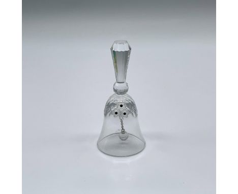 Part of the Exquisite Accents group. A clear crystal bell with three frosted flowers with black centers. Swarovski swan mark.