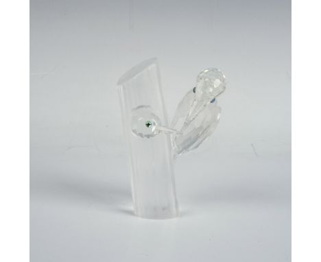 A clear and frosted figure of wood pecking birds with iridescent eyes, perched and inside a tree. Part of the 1988 Annual Edi