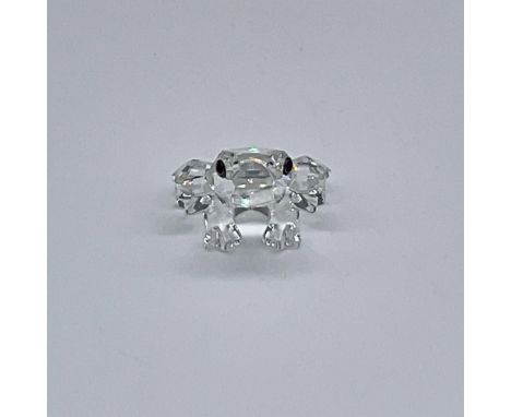 This Swarovski crystal frog was a member of the In the Secret Garden theme. It is made from clear crystal and has black and g