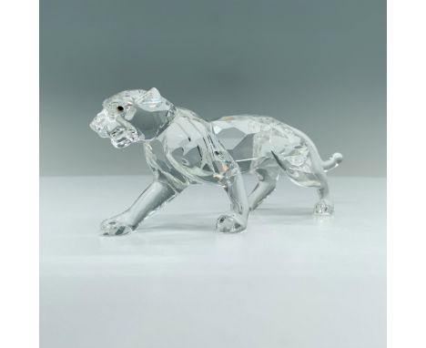 A panther in a strong pose on all fours, ready to pounce on its pray. Swarovski backstamp. This item has its original box whi