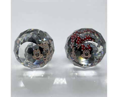 Clear crystal faceted mini orb adorned with Mickey and Minnie's face. Swarovski and Disney marks. Felt bottom protects base. 