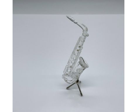 Part of the Crystal Melodies collection. A clear crystal woodwind instrument with a rhodium stand. Swarovski swan mark. This 