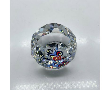 This faceted Swarovski Limited Edition crystal with its 100 years Walt Disney World design in center is a great commemorative